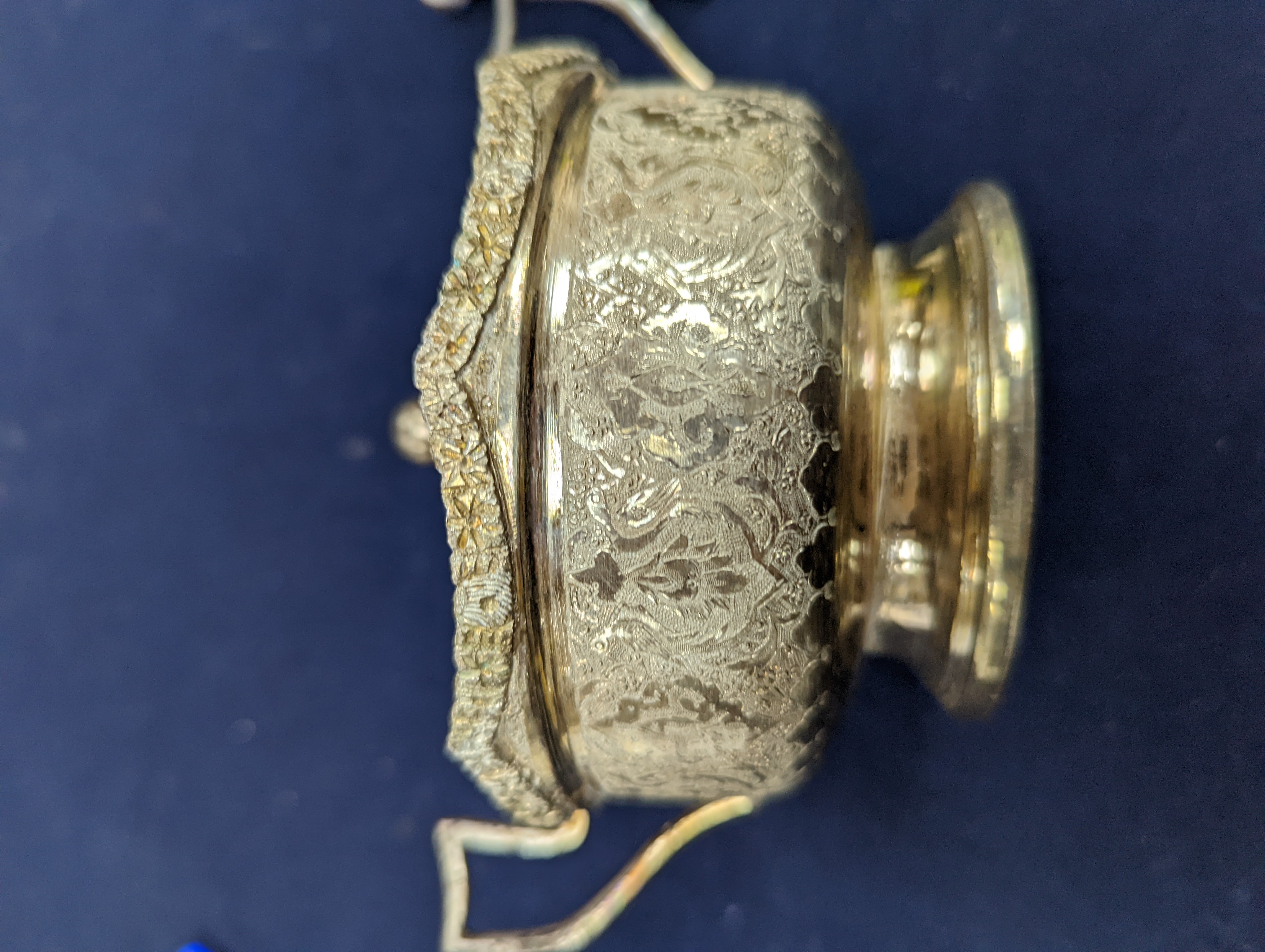 A set of six Persian embossed 84 standard white metal coffee cup holders and matching sugar bowl and cover by Vartan and four other Persian white metal items.